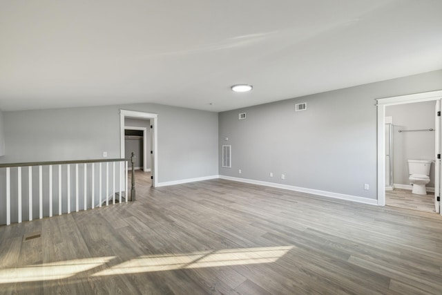 spare room featuring hardwood / wood-style flooring