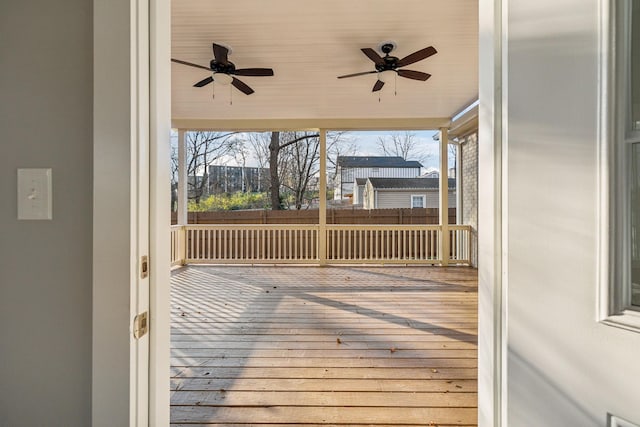 wooden deck featuring ceiling fan