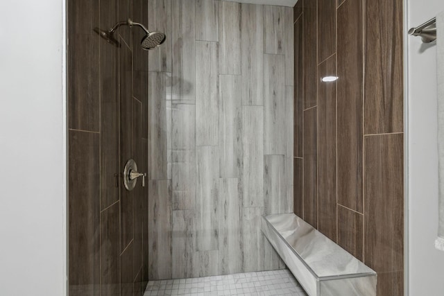 bathroom featuring a tile shower