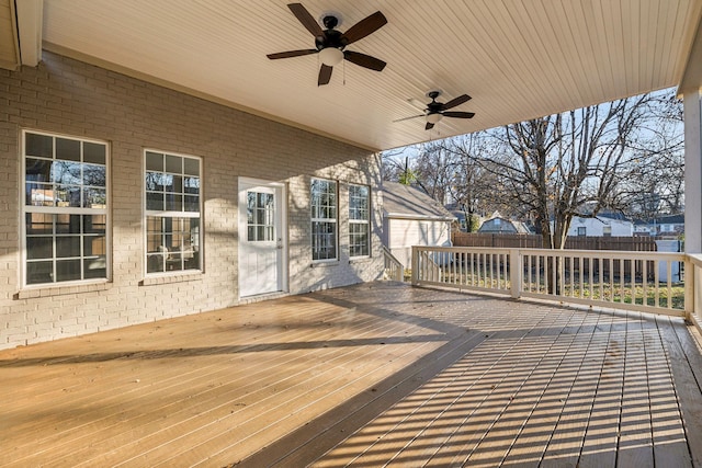 wooden deck featuring ceiling fan