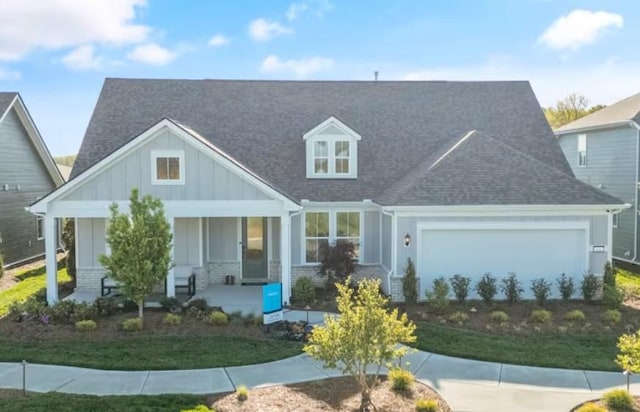 view of front of house featuring a garage and covered porch