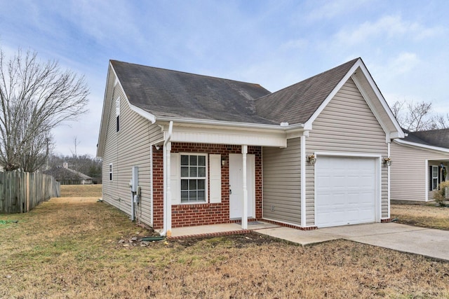 view of front of house with a garage and a front lawn