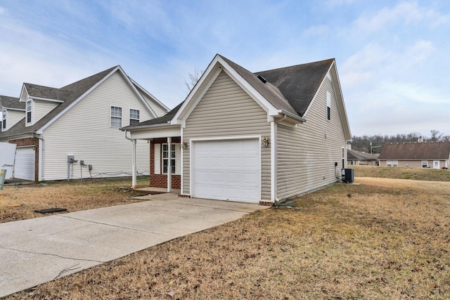 view of front facade featuring central AC, a garage, and a front lawn