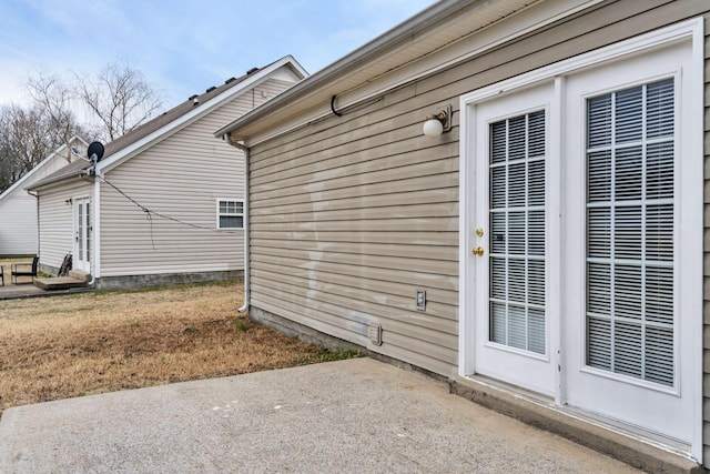 view of side of home featuring a patio