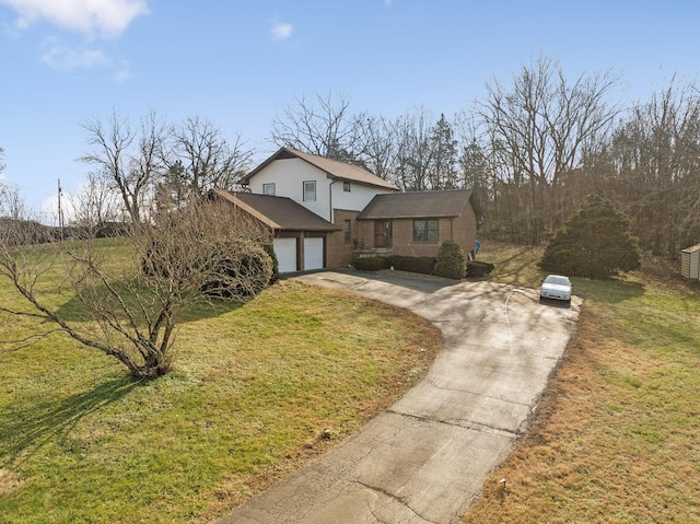 view of front property with a front yard and a garage