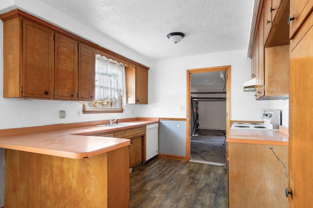 kitchen with white appliances, ventilation hood, dark hardwood / wood-style floors, a textured ceiling, and kitchen peninsula