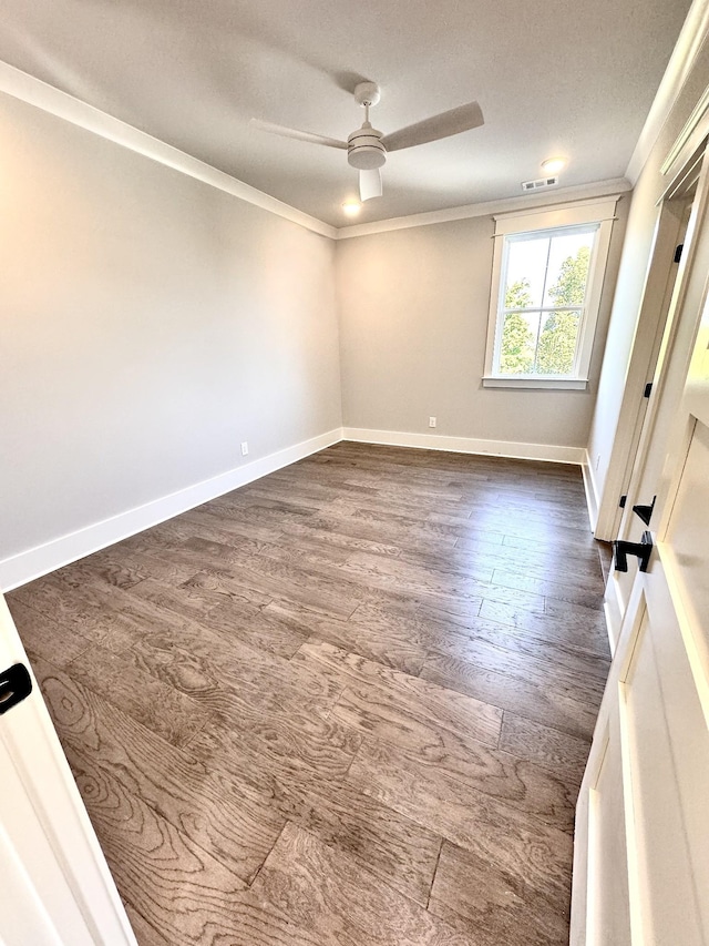 unfurnished room featuring hardwood / wood-style flooring, ceiling fan, and crown molding