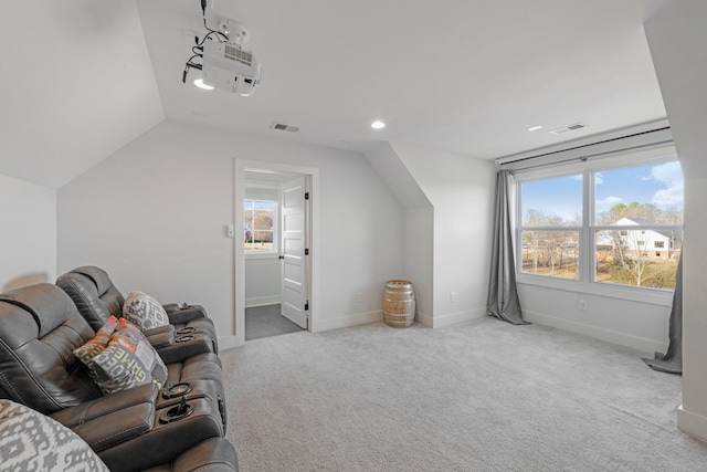 interior space featuring light carpet and vaulted ceiling