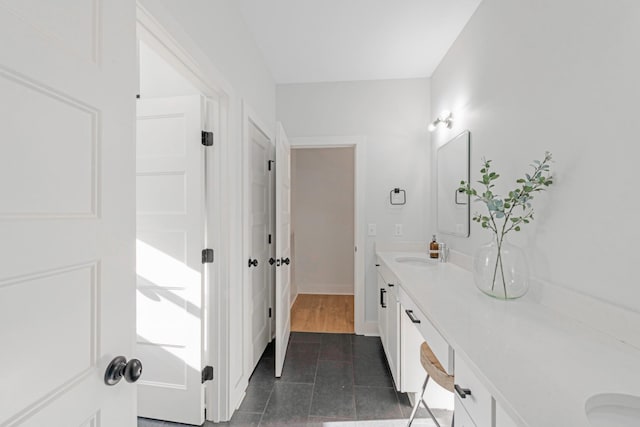 bathroom with hardwood / wood-style floors and vanity