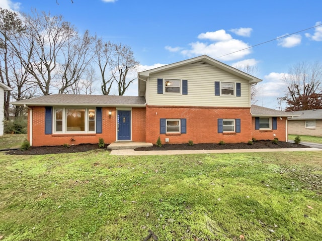 tri-level home with a front lawn