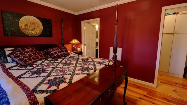 bedroom with wood-type flooring and crown molding