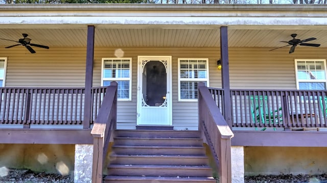 entrance to property with ceiling fan and covered porch