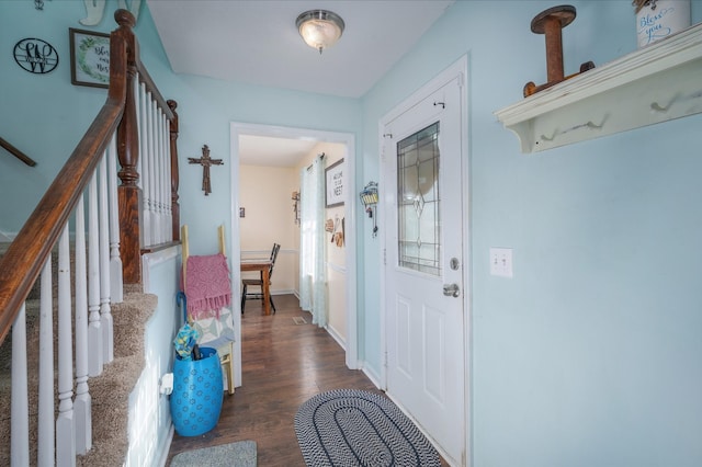 foyer entrance with dark hardwood / wood-style floors