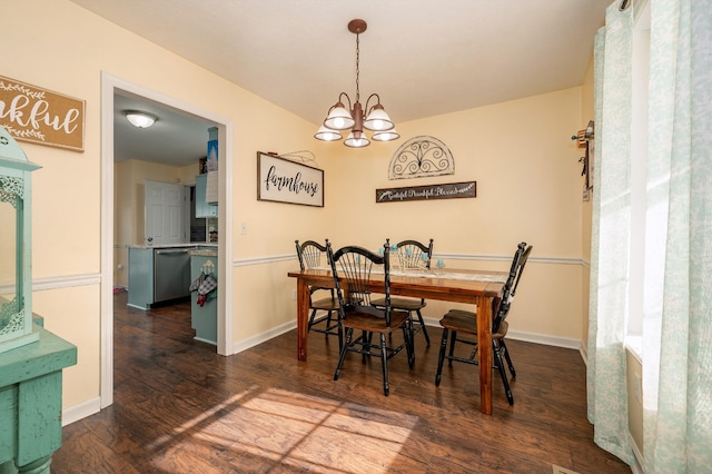 dining area featuring a notable chandelier and dark hardwood / wood-style floors