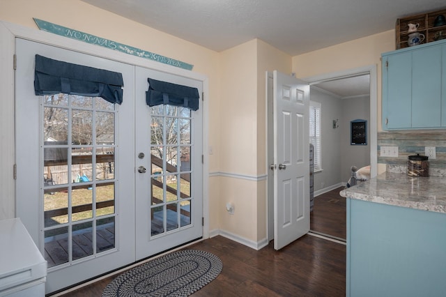 doorway to outside featuring dark hardwood / wood-style flooring and french doors