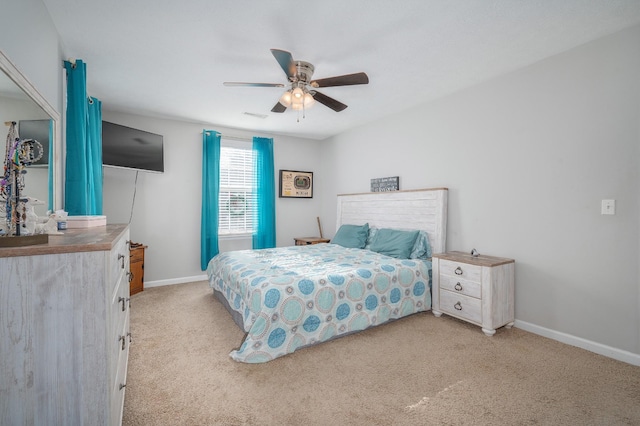 carpeted bedroom featuring ceiling fan