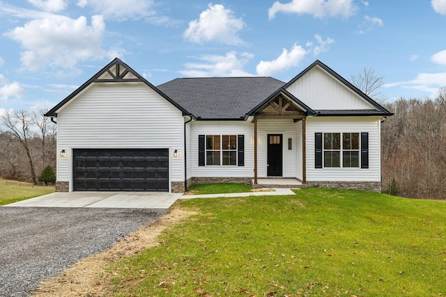 view of front of home featuring a garage and a front lawn