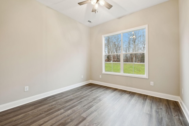 unfurnished room featuring ceiling fan and dark hardwood / wood-style flooring