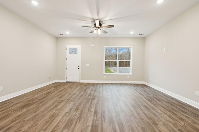 interior space with hardwood / wood-style flooring and ceiling fan