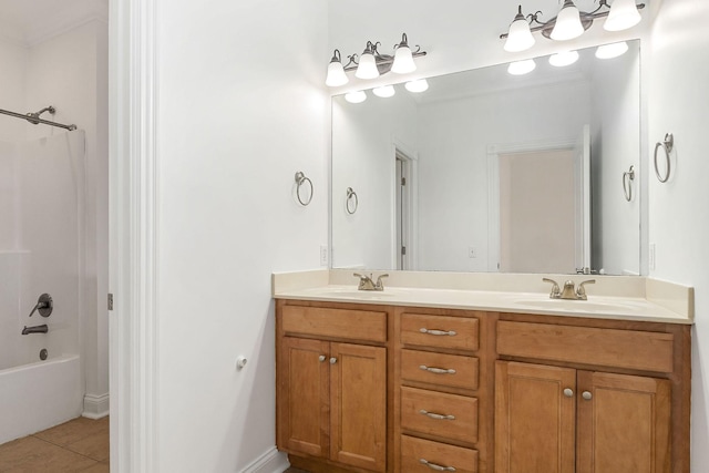 bathroom featuring tile patterned flooring, vanity, and washtub / shower combination