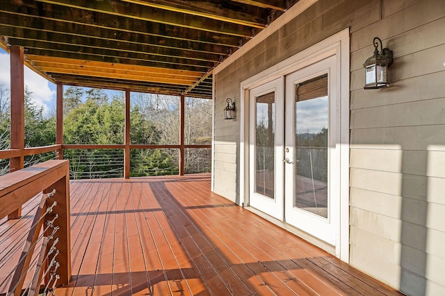 unfurnished sunroom with french doors