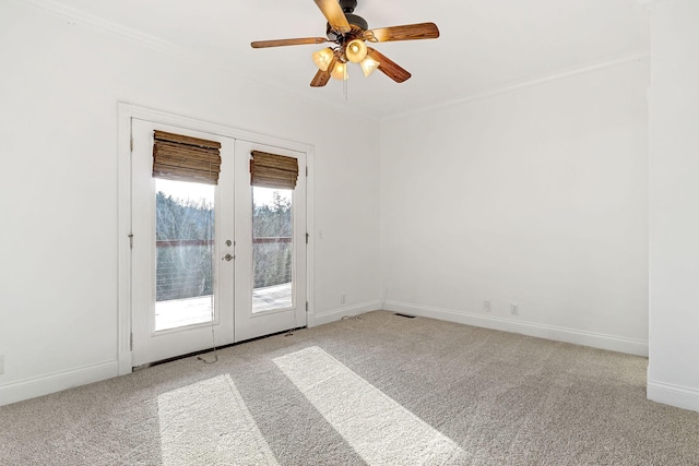 unfurnished room with light carpet, french doors, ceiling fan, and ornamental molding