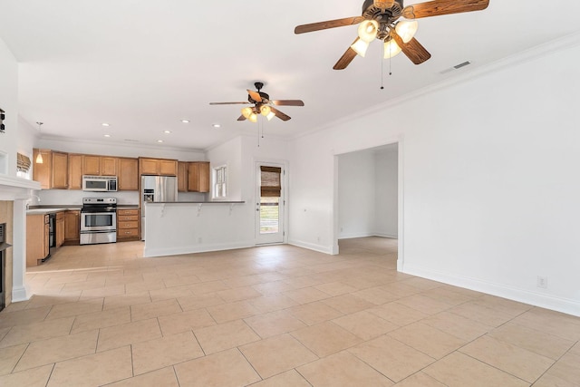 kitchen featuring crown molding, light tile patterned floors, and stainless steel appliances