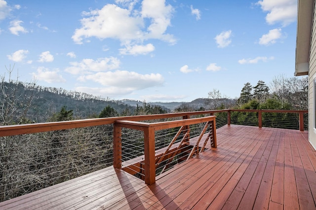 wooden terrace featuring a mountain view