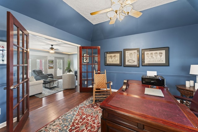 office with ceiling fan, a textured ceiling, dark hardwood / wood-style flooring, vaulted ceiling, and french doors