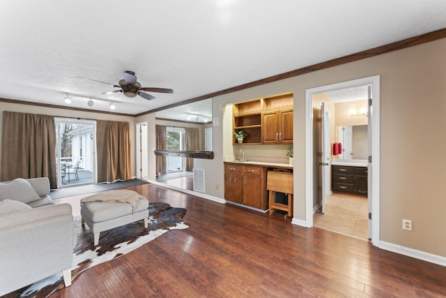 living room with hardwood / wood-style floors, a textured ceiling, and a healthy amount of sunlight