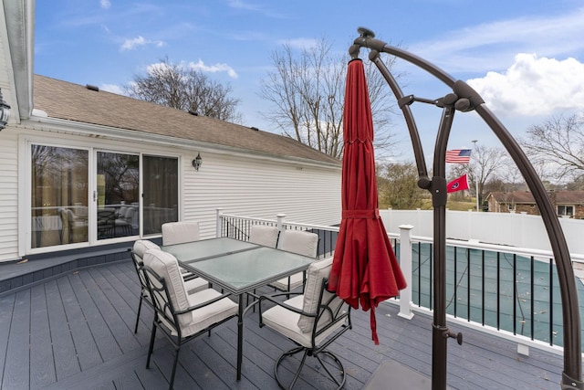 wooden deck featuring a swimming pool