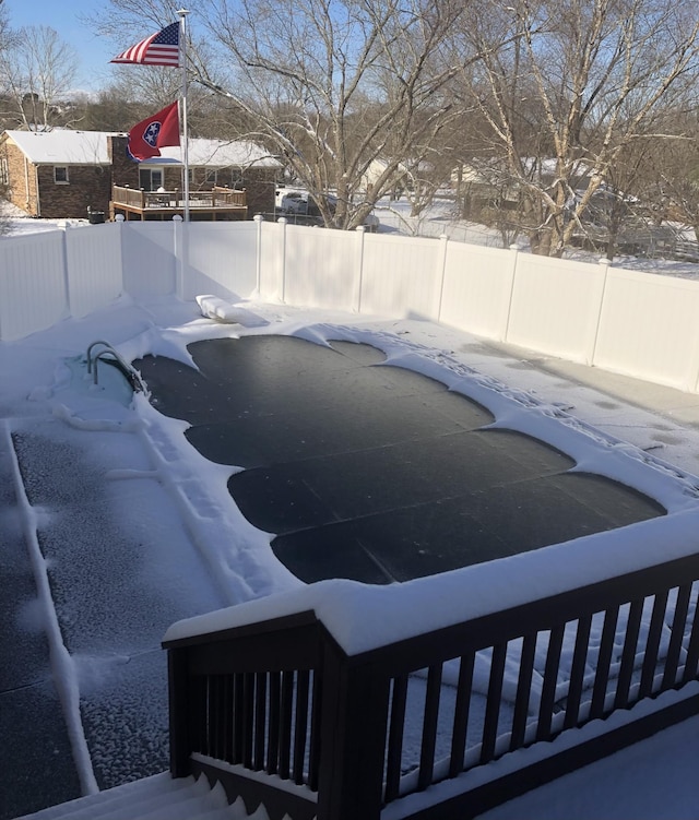 view of snow covered pool