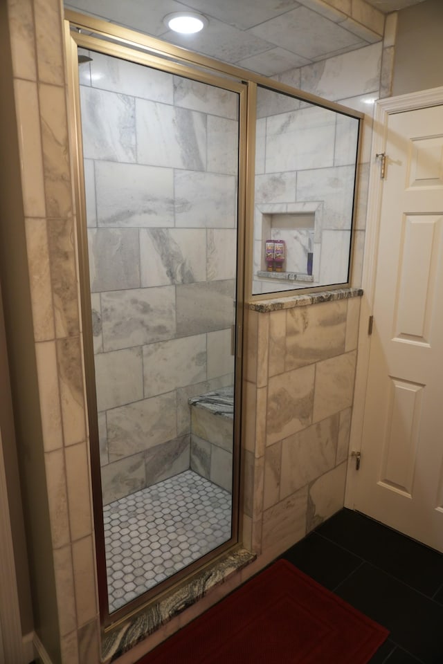 bathroom featuring tile patterned floors and an enclosed shower