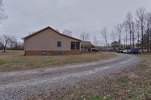 view of side of property featuring central air condition unit