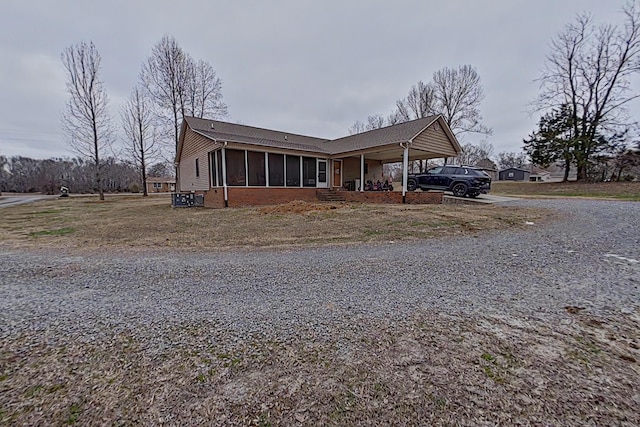 view of front of property featuring a carport