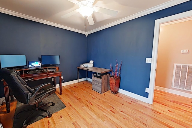 office space with ceiling fan, light wood-type flooring, and ornamental molding