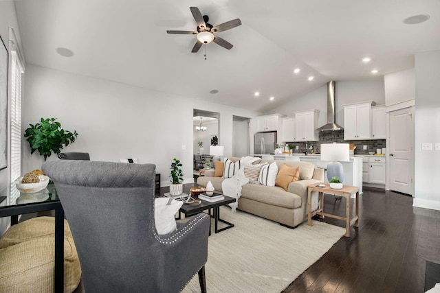 living room with ceiling fan, hardwood / wood-style floors, and lofted ceiling