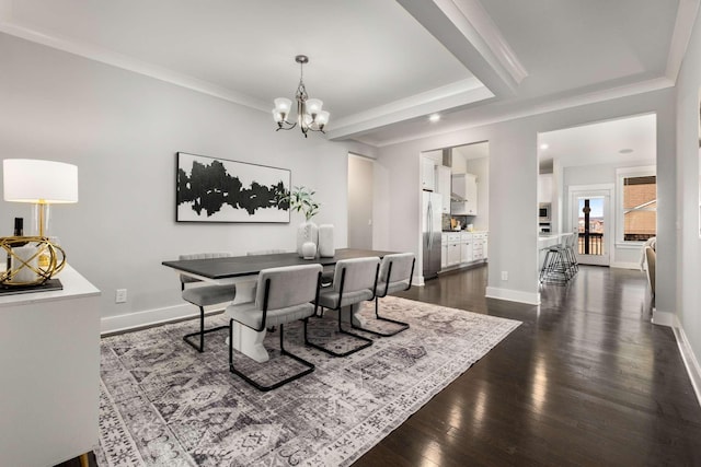 dining space featuring ornamental molding, an inviting chandelier, and dark wood-type flooring