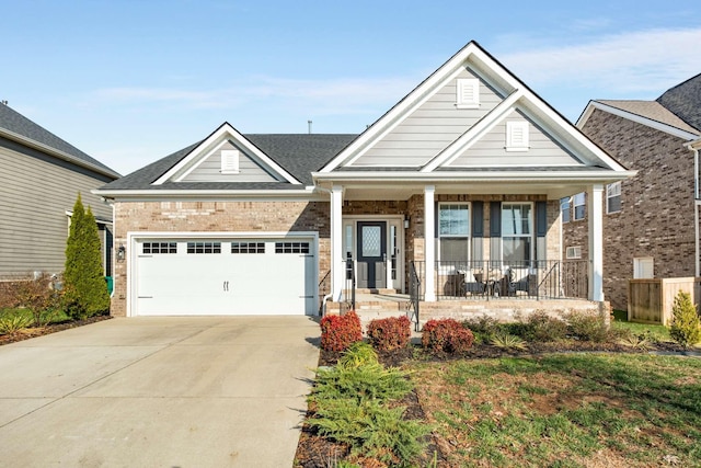 craftsman-style home featuring covered porch and a garage