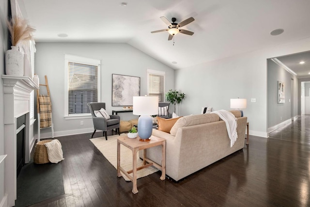 living room featuring lofted ceiling, ceiling fan, and dark hardwood / wood-style floors