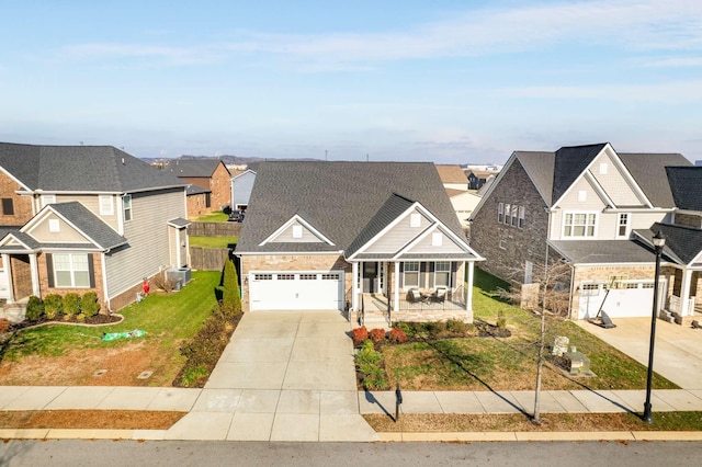 view of front of home featuring covered porch and a garage