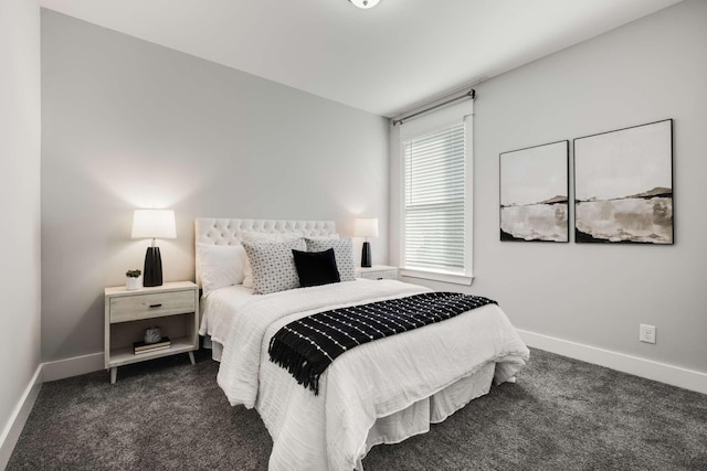 bedroom featuring dark carpet