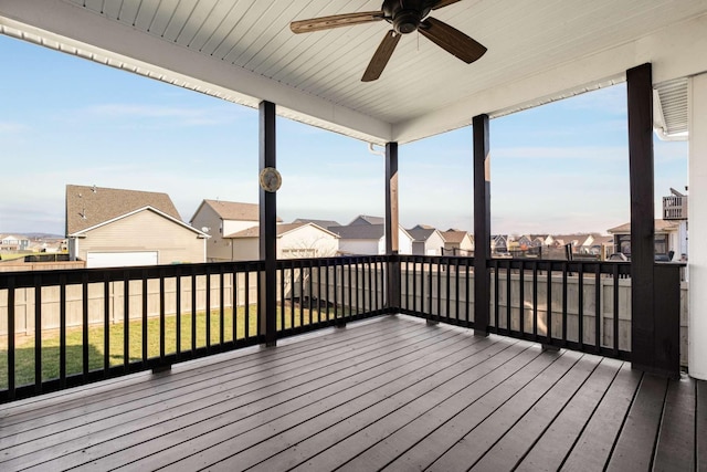 wooden terrace featuring ceiling fan