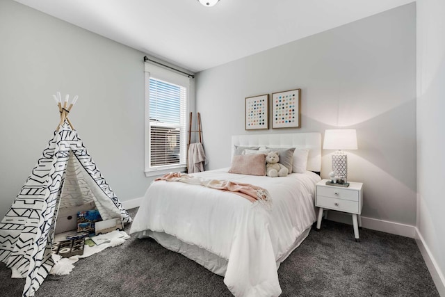 bedroom featuring dark carpet