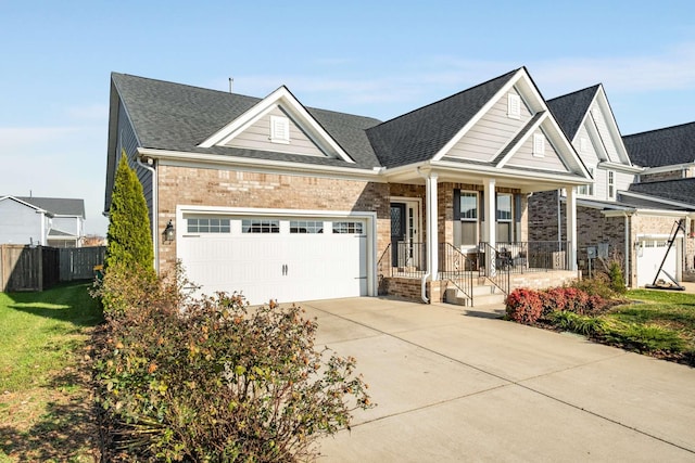 craftsman inspired home with covered porch and a garage