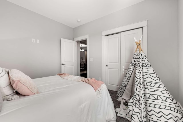 bedroom with carpet floors and a closet