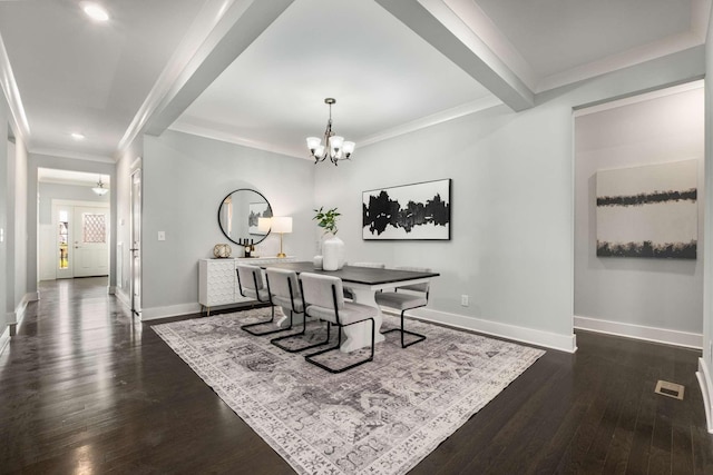 dining space featuring beam ceiling, dark hardwood / wood-style flooring, ornamental molding, and an inviting chandelier