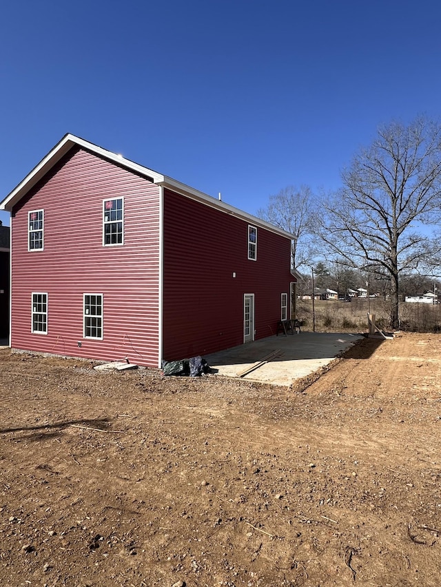 view of property exterior featuring a patio area