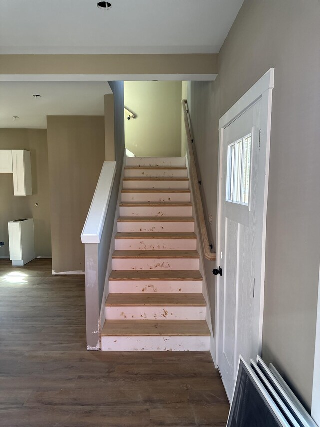 stairs with wood finished floors