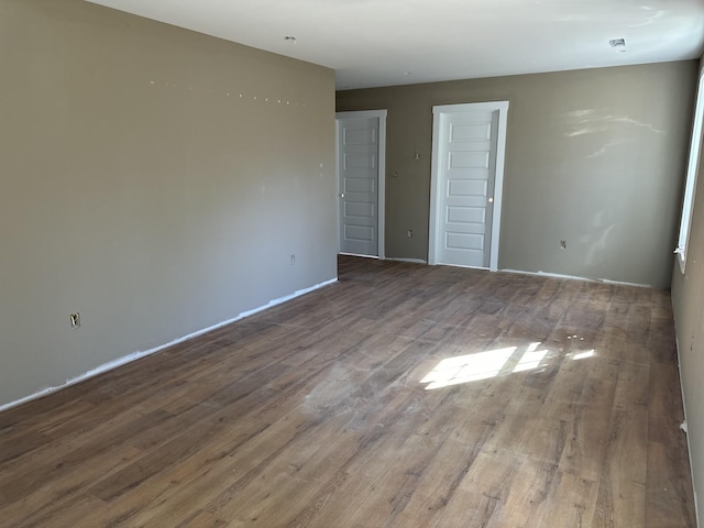 empty room with wood finished floors